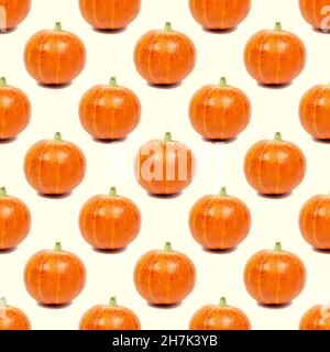 Yellow and orange pumpkin repeat seamless pattern on light background. Stock Photo