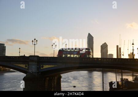 Photos of the crossing of the bridge over the Thames at Chelsea Embankment taken at sunset on a Fall day. Stock Photo