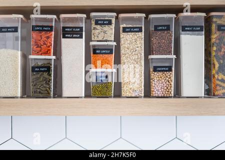 Empty kitchen interior in Nordic style with food placing in plastic boxes for comfortable storage Stock Photo