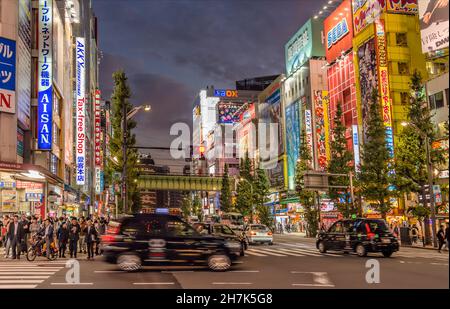 Street scene on Chuo Dori in Akihabara Electric Town district at night, Tokyo, Japan Stock Photo
