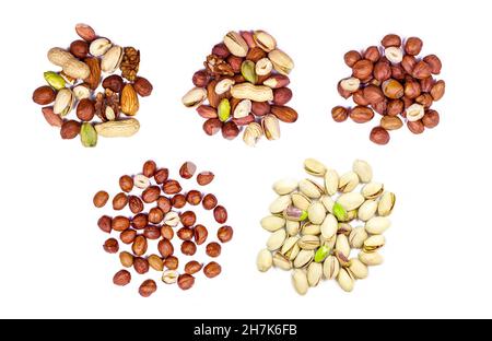 Top view of different nuts mix: almonds, pistachios, peanuts, hazelnuts heap set isolated on white background. Stock Photo