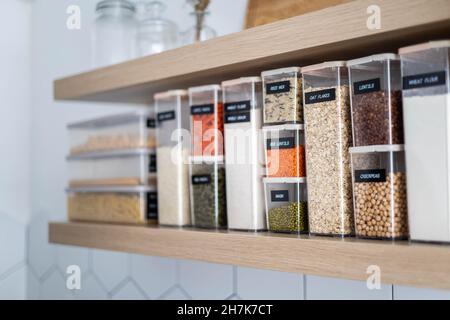Empty kitchen interior in Nordic style with food placing in plastic boxes for comfortable storage Stock Photo