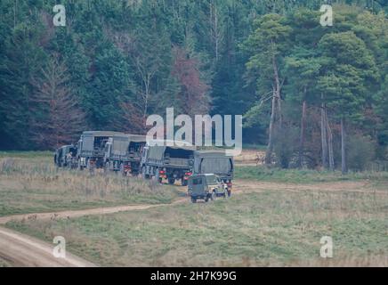 British army utility support vehicle in action on a military exercise, Wiltshire UK Stock Photo