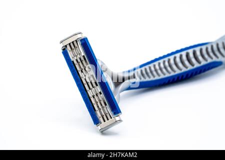 triple blade razor head in blue and gray colors on light background Stock Photo