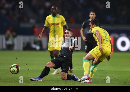 Paris, France, 20th November 2021. Marco Verratti of PSG stretches to pass the ball as Fabio of FC Nantes closes in during the Ligue 1 match at Le Parc des Princes, Paris. Picture credit should read: Jonathan Moscrop / Sportimage Stock Photo