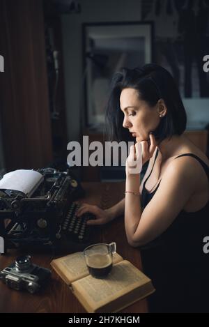 Young hipster woman talking on the phone at home. Stock Photo