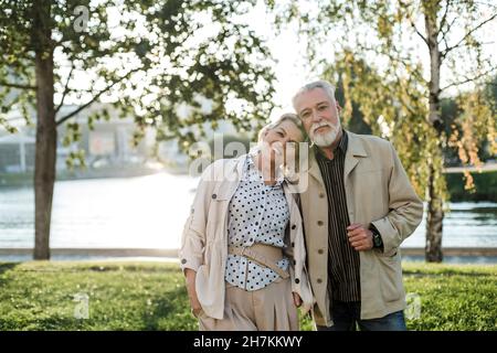 Smiling woman leaning on man shoulder Stock Photo