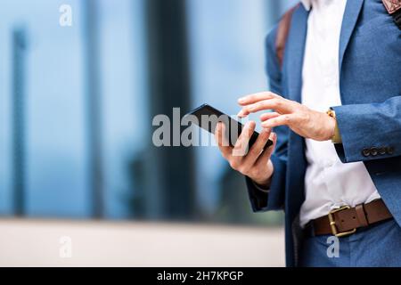 Young male professional using smart phone Stock Photo