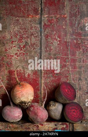 Raw beetroots on weathered wooden surface Stock Photo