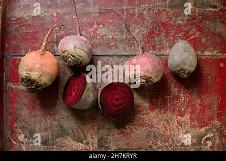Raw beetroots on weathered wooden surface Stock Photo