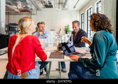Employees working in meeting at office Stock Photo