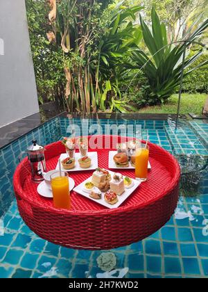 floating breakfast in plunge pool, afternoon tea or floating breakfast in swim pool.  Stock Photo