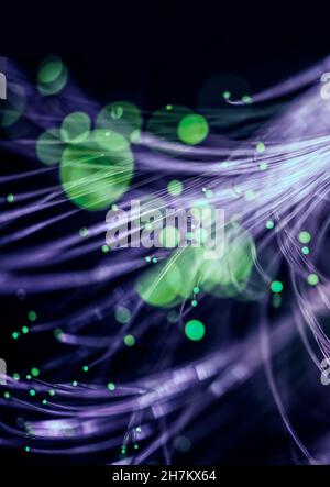 Green fiber optics carrying data across internet Stock Photo