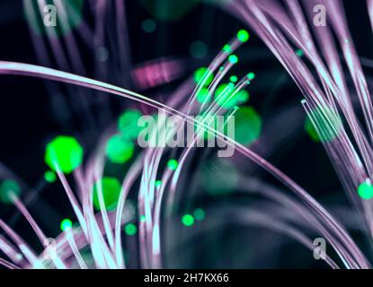 Illuminated fibre optics carrying data across internet Stock Photo