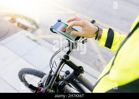 Delivery man using city map on bicycle Stock Photo