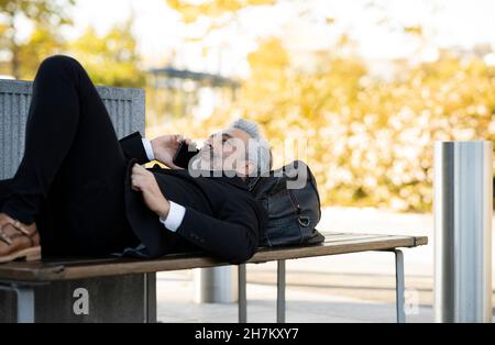 Businessman taking selfie through mobile phone Stock Photo