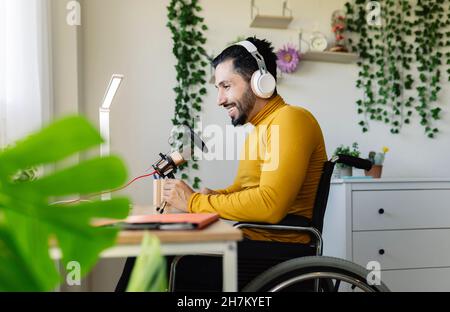 Smiling disabled businessman using virtual reality headset at home Stock Photo