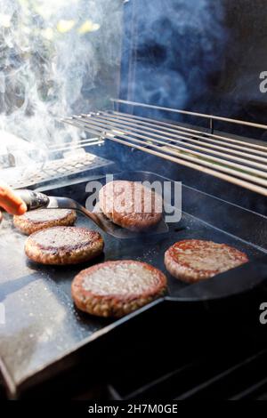 Barbecue grill with smoke on backyard Stock Photo - Alamy