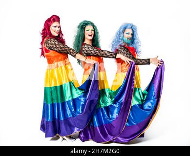 Drag queens with multi colored hand fans over white background Stock Photo