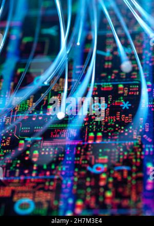 Fiber optics transferring data into circuit board Stock Photo