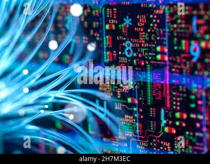 Fiber optics transferring data into circuit board Stock Photo