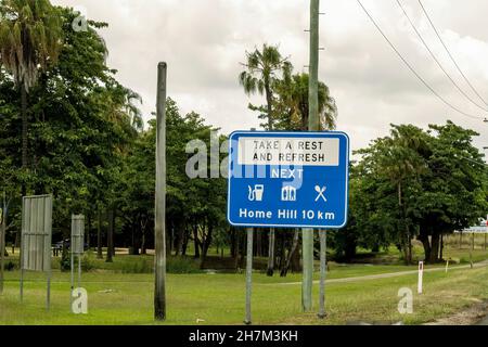 Townsville to Mackay highway, Queensland, Australia - November 2021: Roadside sign advising motorists to take a break and refresh at next rest stop Stock Photo