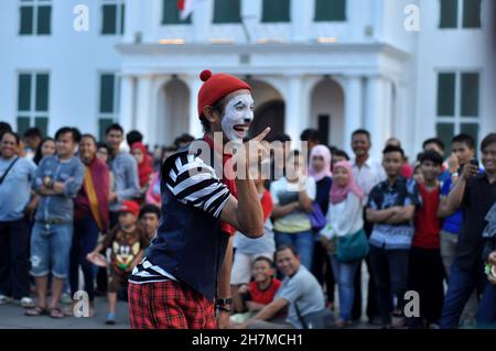 Jakarta, Indonesia - January 17, 2015 : A street mime artist performing in the courtyard of Fatahillah Park, Jakarta, Indonesia Stock Photo