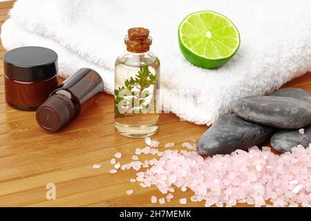 Beauty treatment items for spa procedures on wooden table Stock Photo