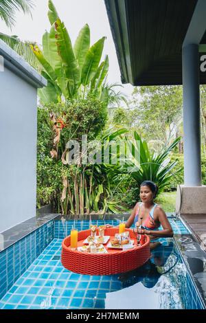 floating breakfast in plunge pool, afternoon tea or floating breakfast in swim pool. High quality photo Stock Photo