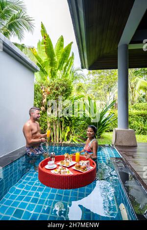 floating breakfast in plunge pool, afternoon tea or floating breakfast in swim pool. High quality photo Stock Photo