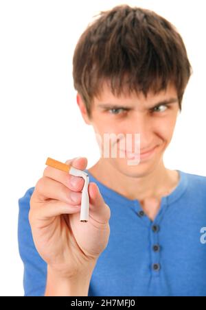Young Man Destroy a Cigarette on the White Background. Focus on the Hand Stock Photo
