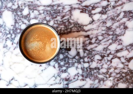 Fresh black coffee in ceramic cup on marble table, top view Stock Photo