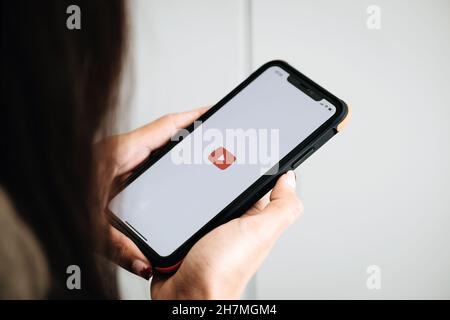 CHIANG MAI,THAILAND - Nov 07, 2021 : Women showing screen shot of Youtube on smartphone, YouTube is the popular online video sharing website. Stock Photo