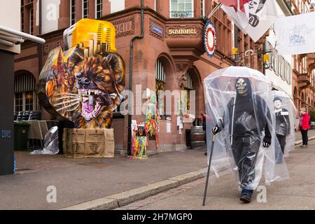 Basel, Switzerland - February 21. Carnival revellers in  makeshift hazmat dress costumes Stock Photo