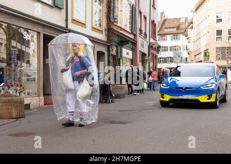 Basel, Switzerland - February 21. A single carnival reveller in a makeshift hazmat dress costume Stock Photo