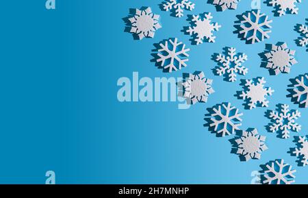 Christmas background. Snowflake pattern. White snowflakes on blue. Snow. Winter mood. Conceptual abstraction. Styrofoam snowflake. New Year's pattern. Copy space. Texture. Stock Photo