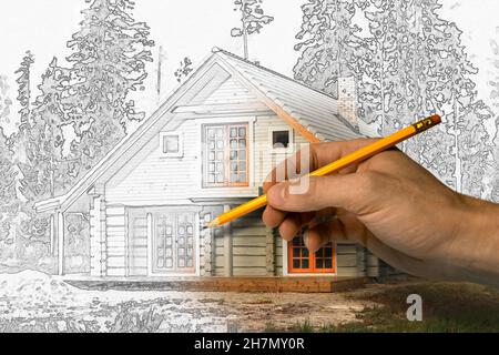 house project drawing - architect draws wooden lodge with pencil Stock Photo