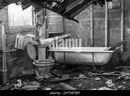 Old bath and toilet with collapsing roof of abandoned croft house in Isle of Harris, Outer Hebrides, Scotland UK in November - disrepair Stock Photo