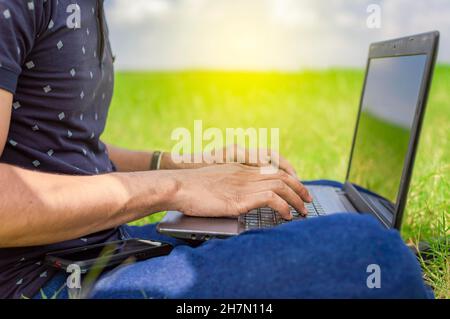 Hands on laptop keyboard, close up of hands on keyboard Stock Photo