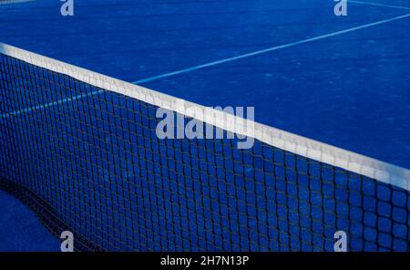 Partial view of a blue paddle tennis court Stock Photo