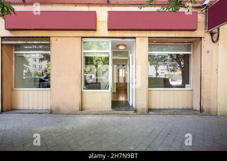 Facade of a building with commercial premises on the ground floor Stock Photo