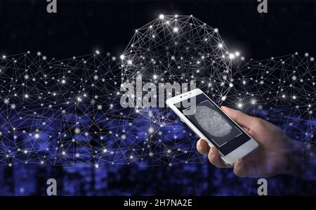 Global network against a dark background. Hand hold white smartphone with digital hologram fingerprint sign on city dark blurred background. Fingerpri Stock Photo