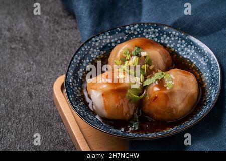 Close up of Bawan (Ba wan), Taiwanese meatball delicacy, delicious street food, steamed starch wrapped round shaped dumpling with pork and shrimp insi Stock Photo