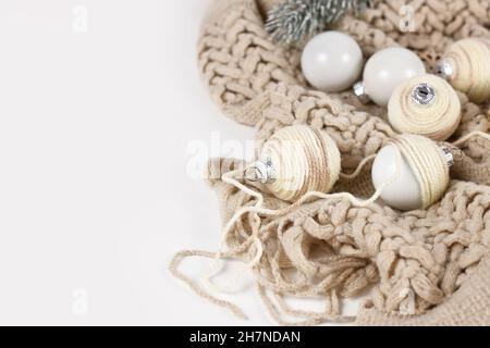 DIY boho style Christmas bauble ornaments with with cream colored cord Stock Photo