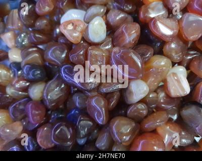 Close-up on many jasper spheres, full screen, top view. Stock Photo