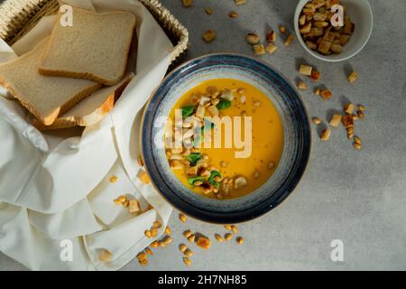 healthy fresh creamy pumpkin soup composition Stock Photo