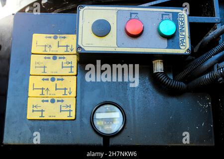 Madrid, Spain- November 14, 2021: Control panel on the side of a crane truck Stock Photo