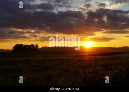 Sunset in the Sauerland. Landscape with setting sun in the evening. Stock Photo