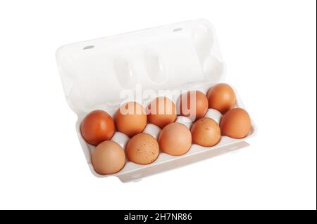 Large red rural eggs in a plastic patch isolated on white background Stock Photo
