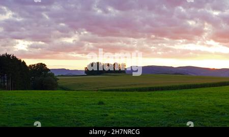 Sunset in the Sauerland. Landscape with setting sun in the evening. Stock Photo